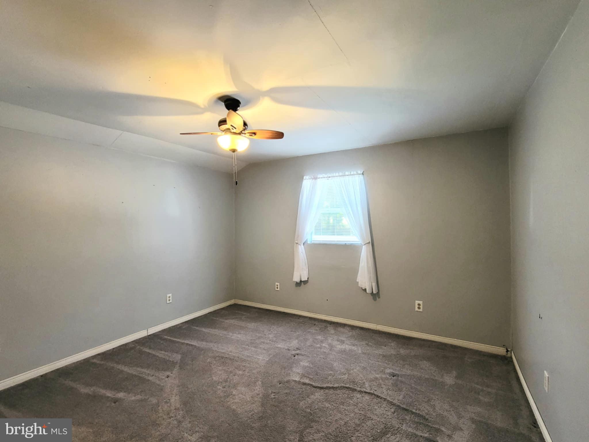 142 Hillcrest Street Winburne, PA 16879 - Photo 20 of 26 an empty room with chandelier fan and windows