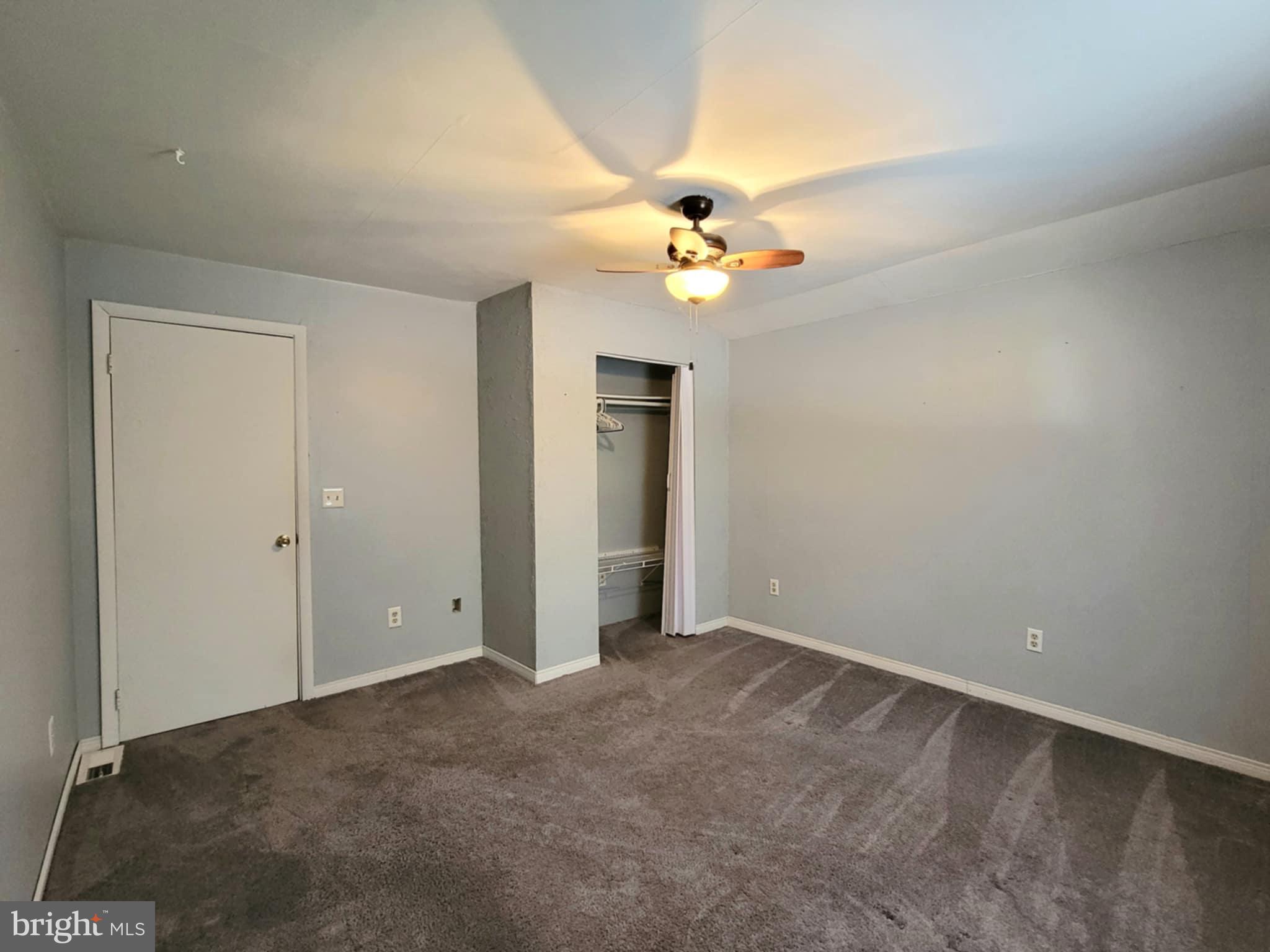 142 Hillcrest Street Winburne, PA 16879 - Photo 22 of 26 an empty room with a bathroom and a fan