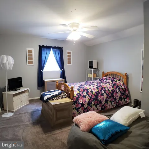 a bedroom with furniture and a fireplace
