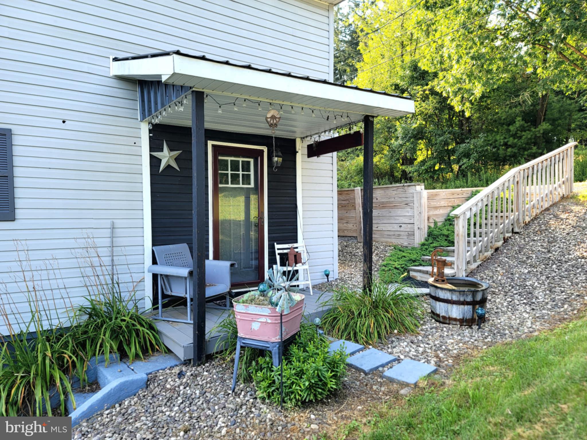 142 Hillcrest Street Winburne, PA 16879 - Photo 3 of 26 a view of a chairs and table in backyard of the house