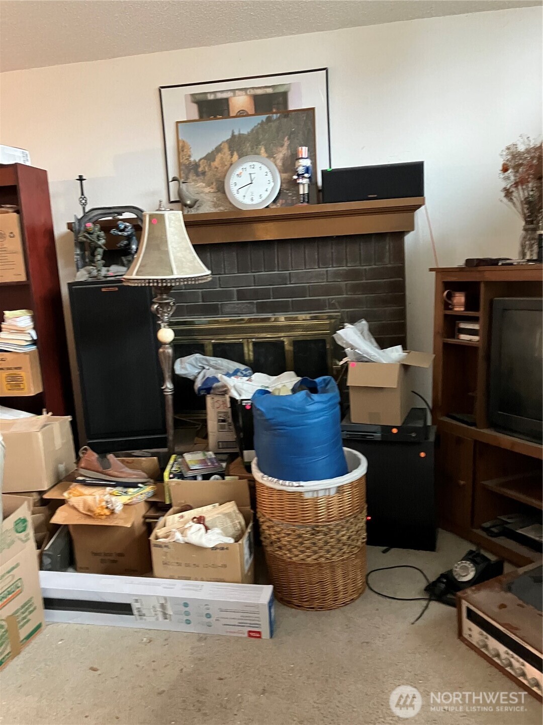 2625 Southwest 337th Street Federal Way, WA 98023 - Photo 2 of 3 a living room with furniture a flat screen tv and a fireplace