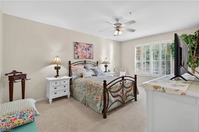 a bedroom with bed and windows