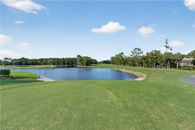 a view of a swimming pool and a yard