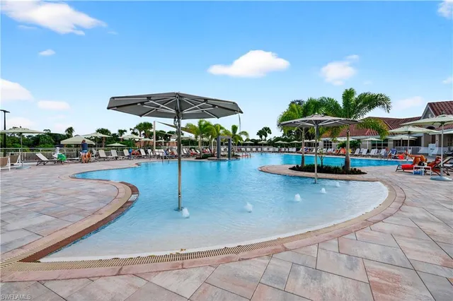 an outdoor space with patio and white umbrellas