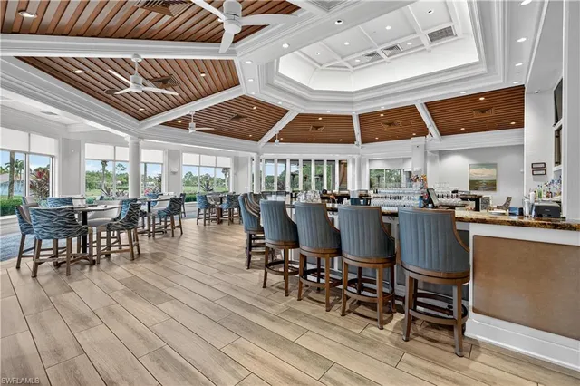 a dining room with furniture a rug and a chandelier