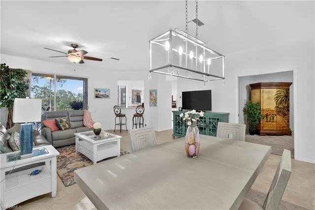 a view of living room with furniture and a chandelier