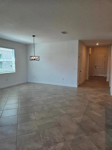 a large kitchen with kitchen island a sink stainless steel appliances and cabinets