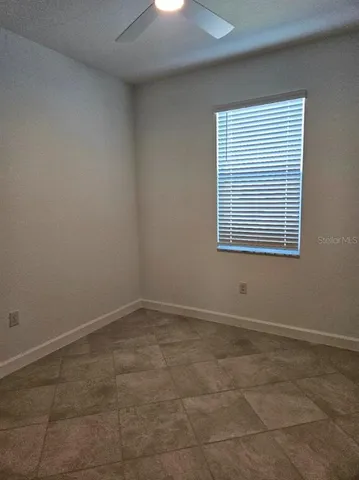 a bathroom with a sink toilet vanity and shower