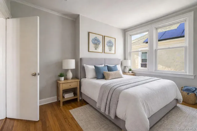 a bedroom with bed and a window