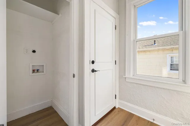 a view of a bathroom with wooden floor