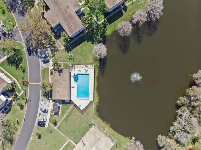 an aerial view of a house with outdoor space