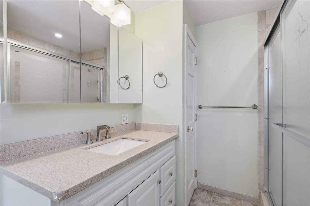 53 Kendall Street Lawrence, MA 01841 - Photo 13 of 36 a bathroom with a sink vanity granite and shower
