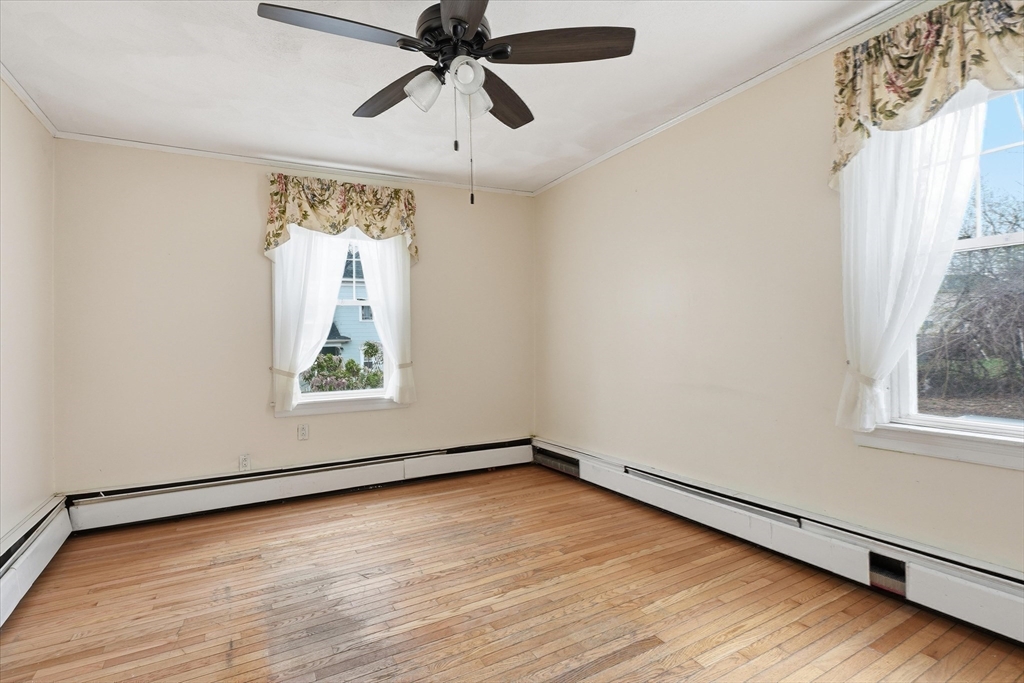 53 Kendall Street Lawrence, MA 01841 - Photo 16 of 36 wooden floor in an empty room with a window