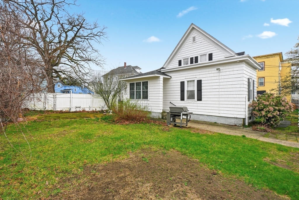 53 Kendall Street Lawrence, MA 01841 - Photo 35 of 36 a front view of a house with yard and green space