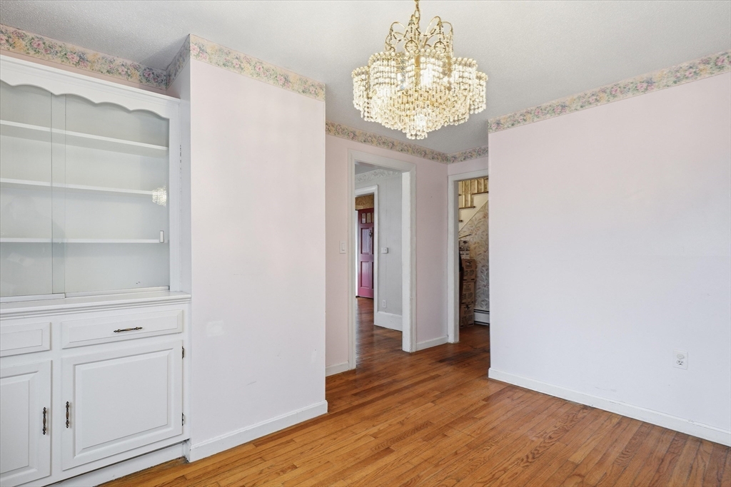 53 Kendall Street Lawrence, MA 01841 - Photo 8 of 36 a view of a room with wooden floor and chandelier
