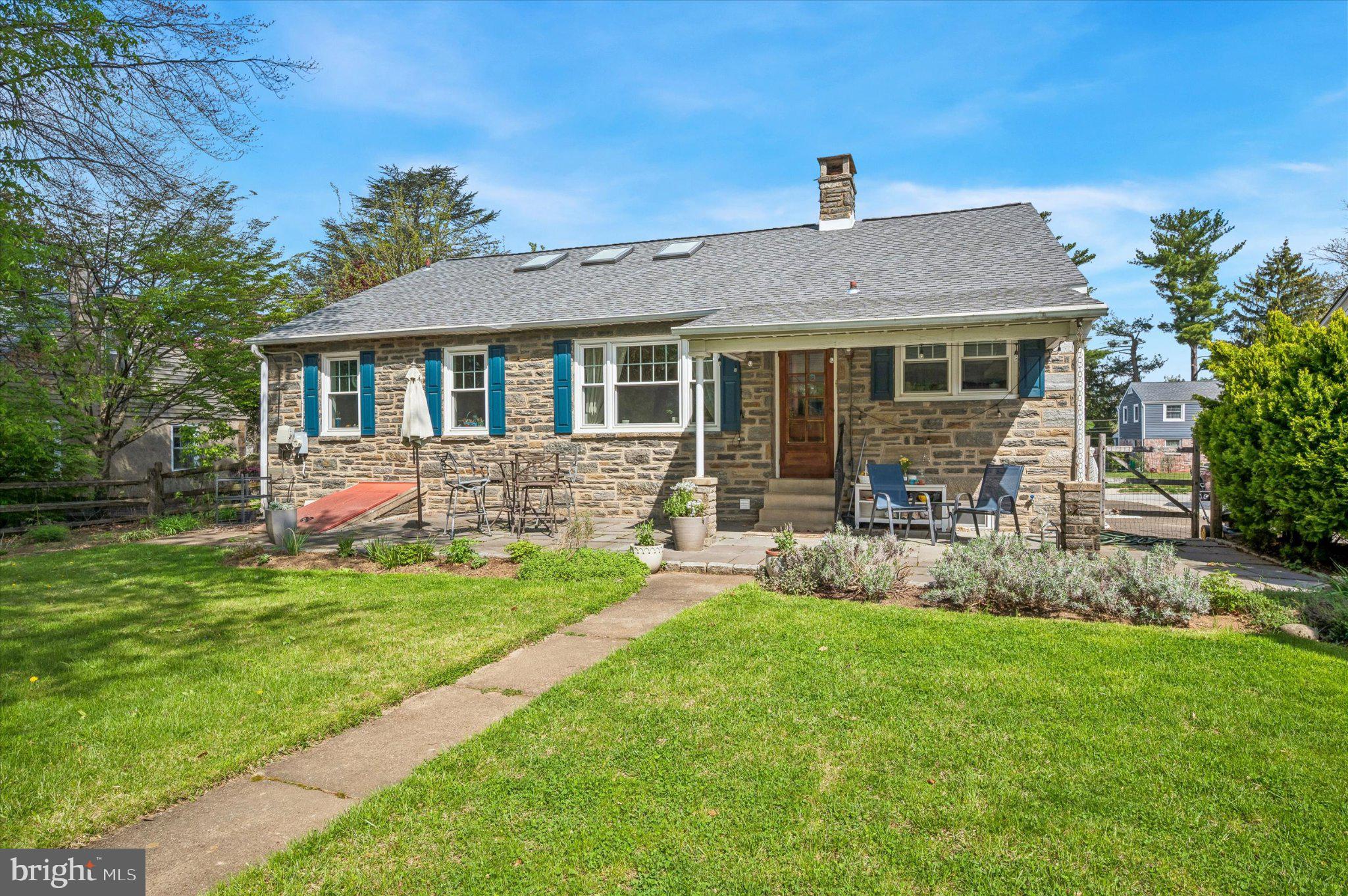 24 McCloskey Road Flourtown, PA 19031 - Photo 25 of 25 Charming stone home with lush greenery.