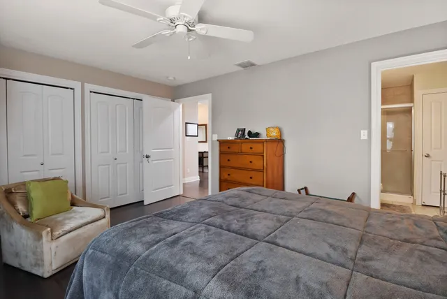 a bedroom with a bed and a couch