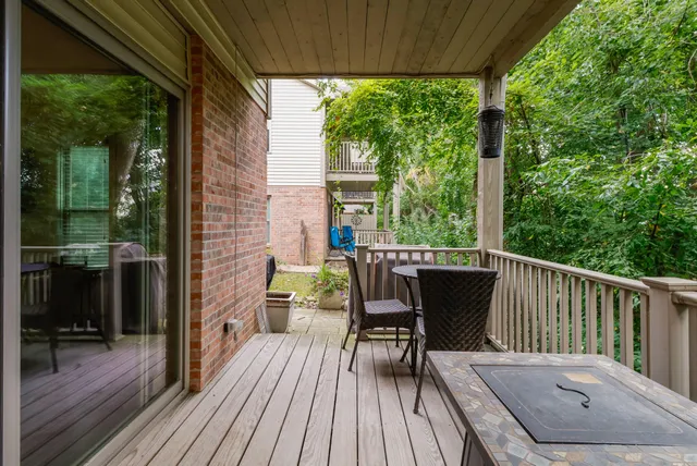 a view of balcony with furniture and wooden deck