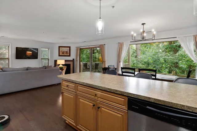 a view of a living room and kitchen floor