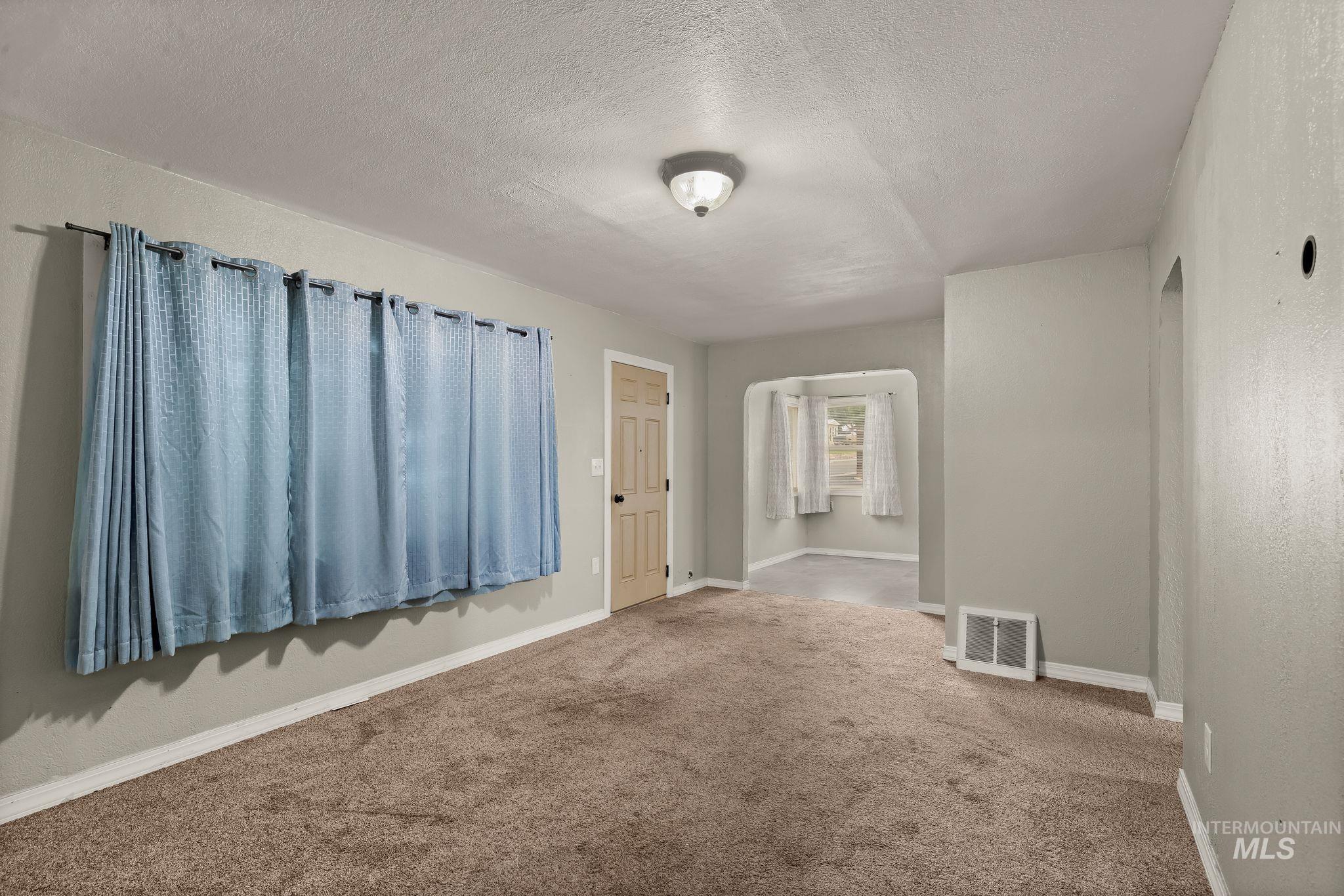 2255 Appleside Boulevard Clarkston, WA 99403 - Photo 11 of 41 Carpeted interior room with light gray walls and white baseboards