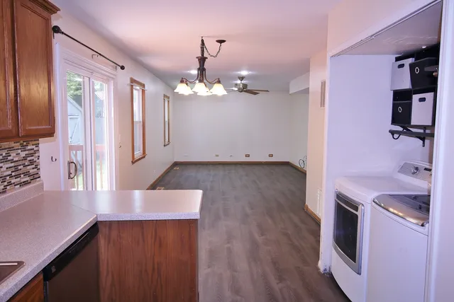 a view of a kitchen cabinets and wooden floor