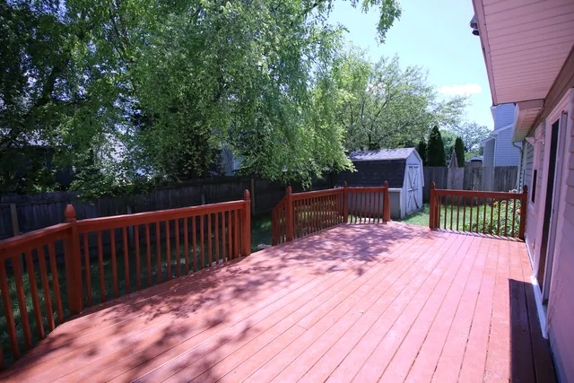 a balcony with wooden floor