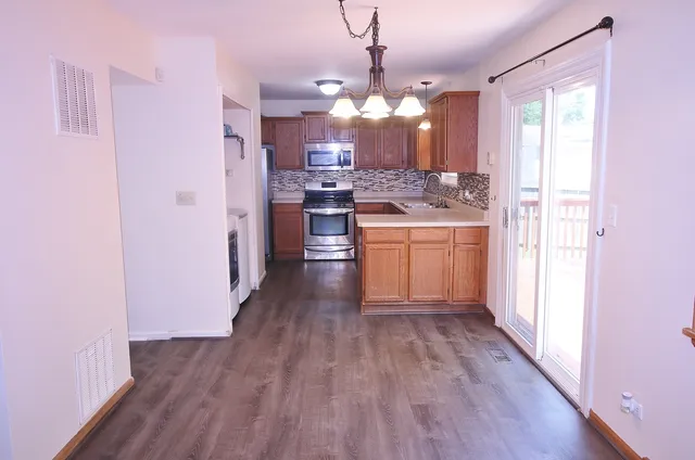 a view of a kitchen and a sink