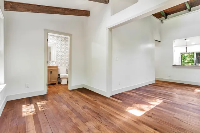 a view of an entryway with wooden floor