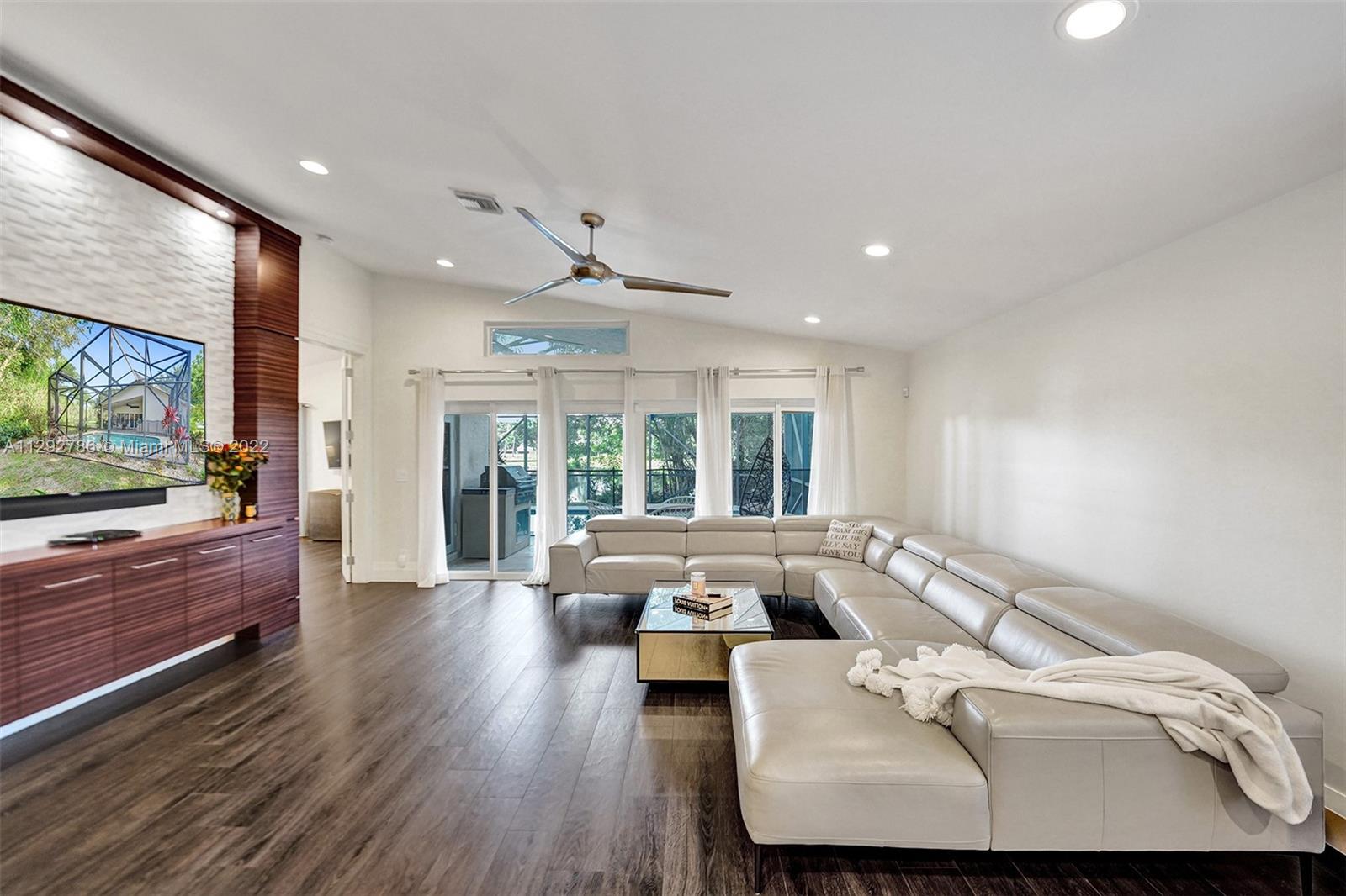 10150 Camelback Lane Boca Raton, FL 33498 - Photo 11 of 67 a living room with furniture and a large window