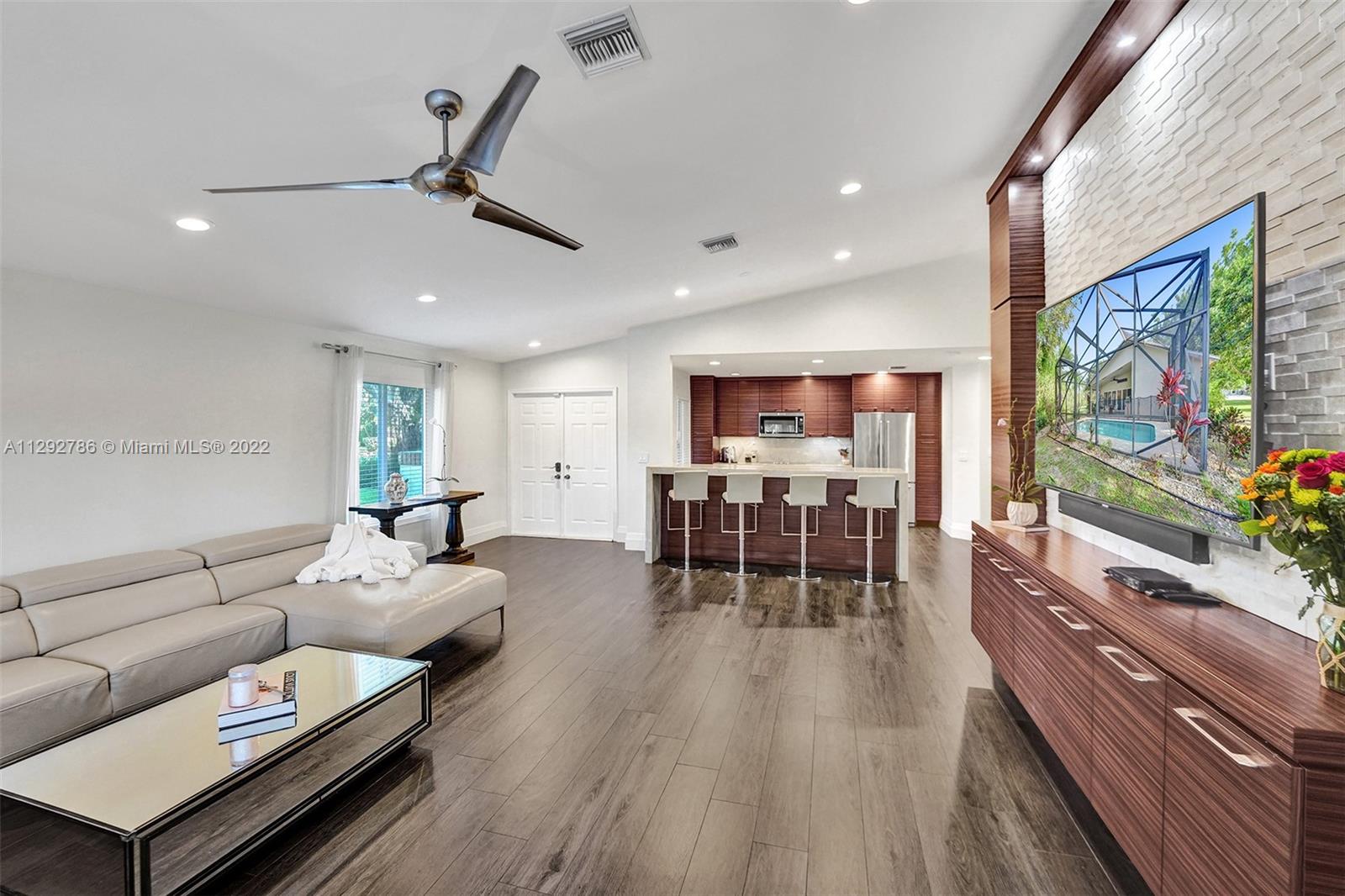 10150 Camelback Lane Boca Raton, FL 33498 - Photo 13 of 67 a living room with furniture and a flat screen tv
