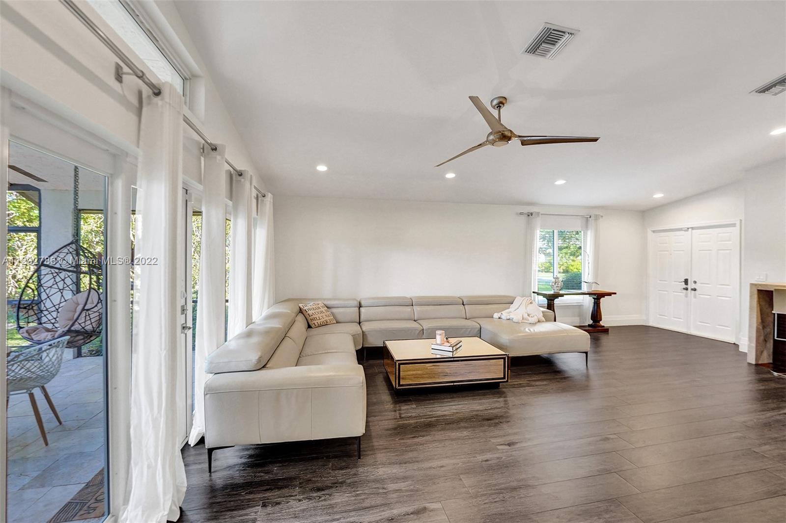 10150 Camelback Lane Boca Raton, FL 33498 - Photo 14 of 67 a living room with furniture and wooden floor