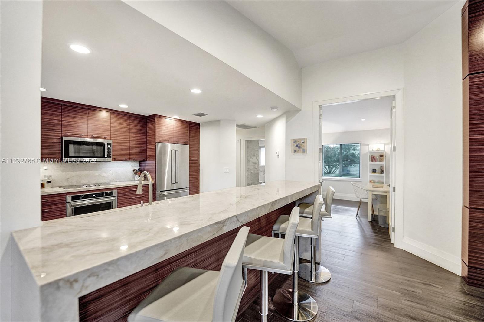 10150 Camelback Lane Boca Raton, FL 33498 - Photo 15 of 67 a large kitchen with stainless steel appliances lots of counter space and breakfast area
