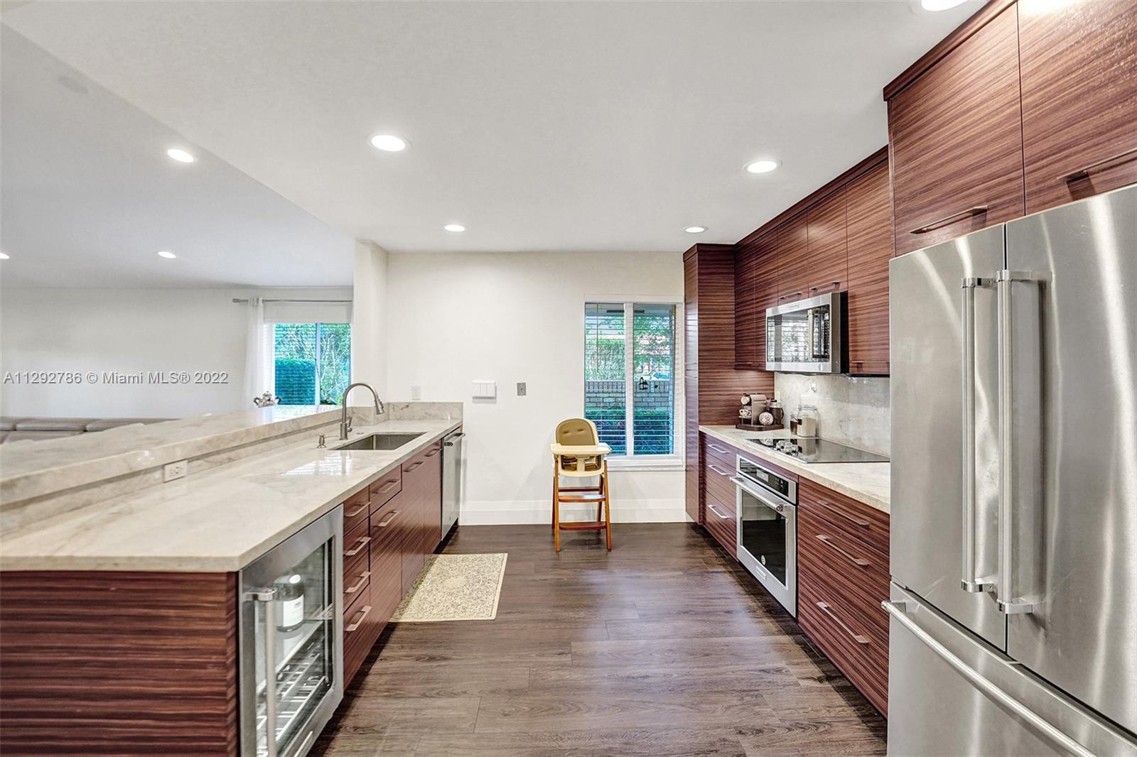 10150 Camelback Lane Boca Raton, FL 33498 - Photo 2 of 67 a large kitchen with stainless steel appliances a stove a sink dishwasher and a refrigerator