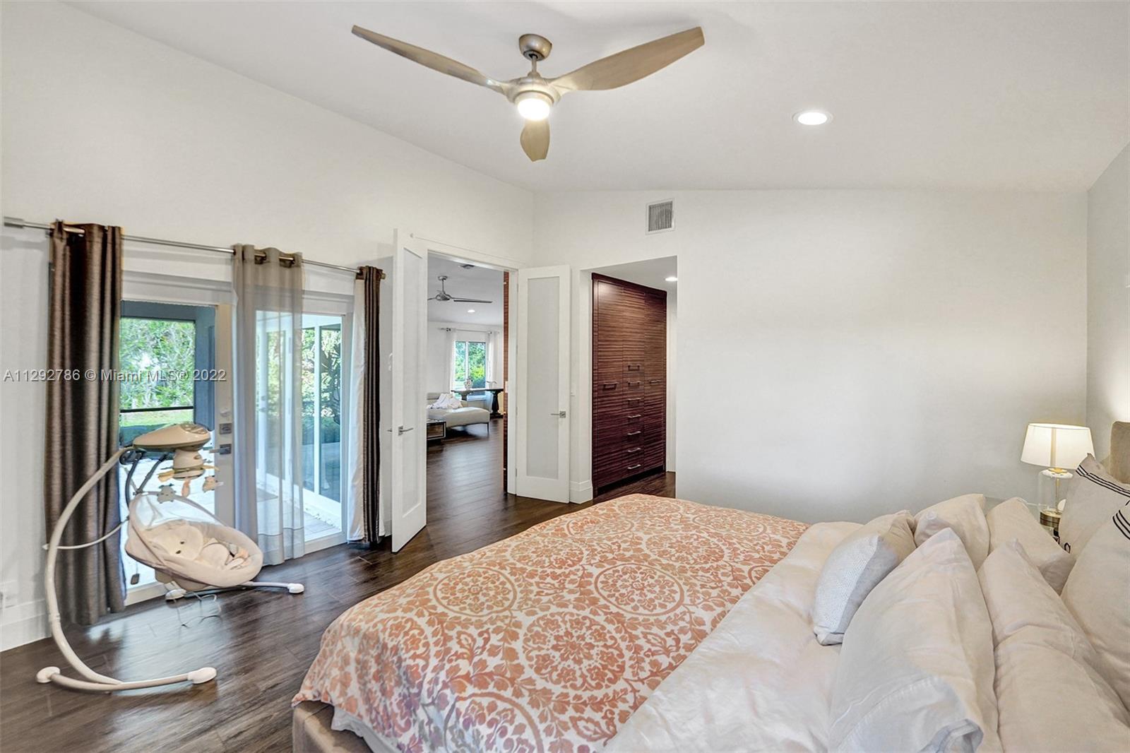 10150 Camelback Lane Boca Raton, FL 33498 - Photo 23 of 67 a bedroom with a bed and wooden floor
