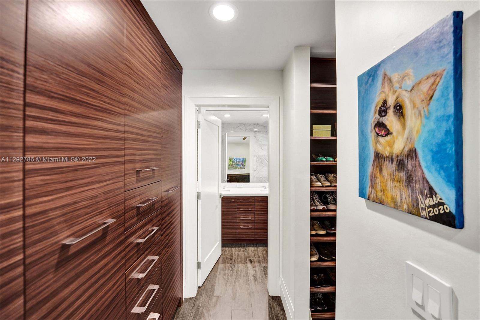 10150 Camelback Lane Boca Raton, FL 33498 - Photo 25 of 67 a view of a hallway with wooden floor and door
