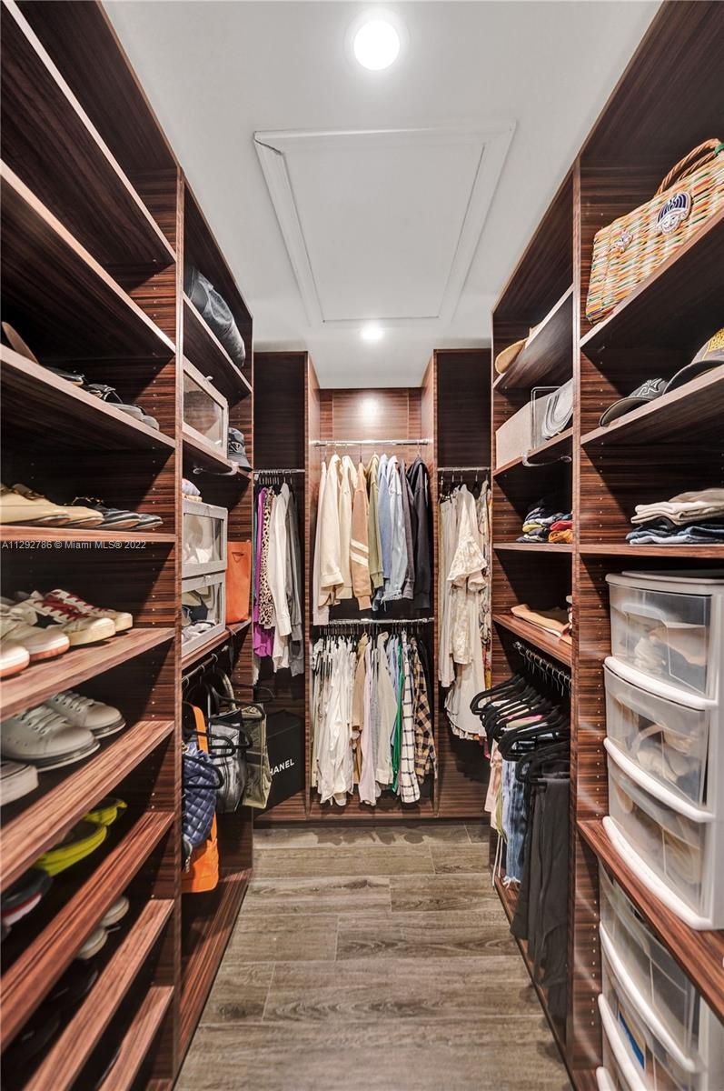 10150 Camelback Lane Boca Raton, FL 33498 - Photo 27 of 67 a view of walk in closet with clothes and shoes