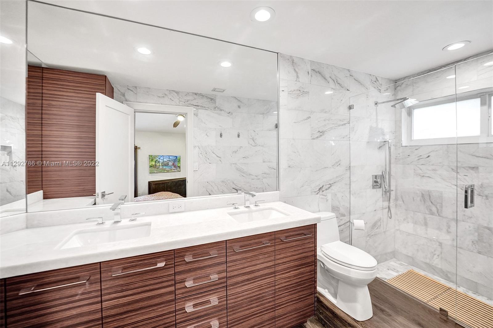 10150 Camelback Lane Boca Raton, FL 33498 - Photo 29 of 67 a bathroom with a sink a toilet and shower