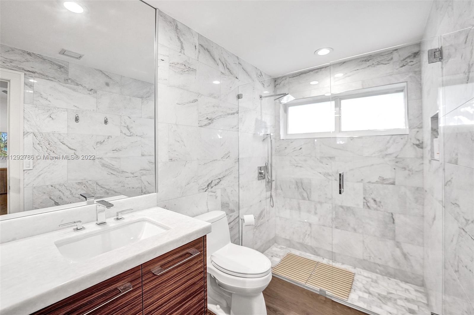 10150 Camelback Lane Boca Raton, FL 33498 - Photo 30 of 67 a bathroom with a sink toilet and shower