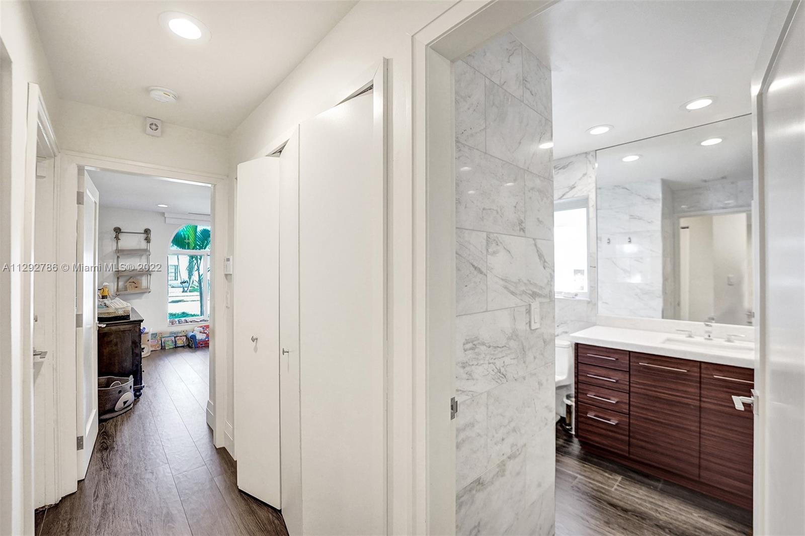 10150 Camelback Lane Boca Raton, FL 33498 - Photo 35 of 67 a bathroom with a mirror and a shower