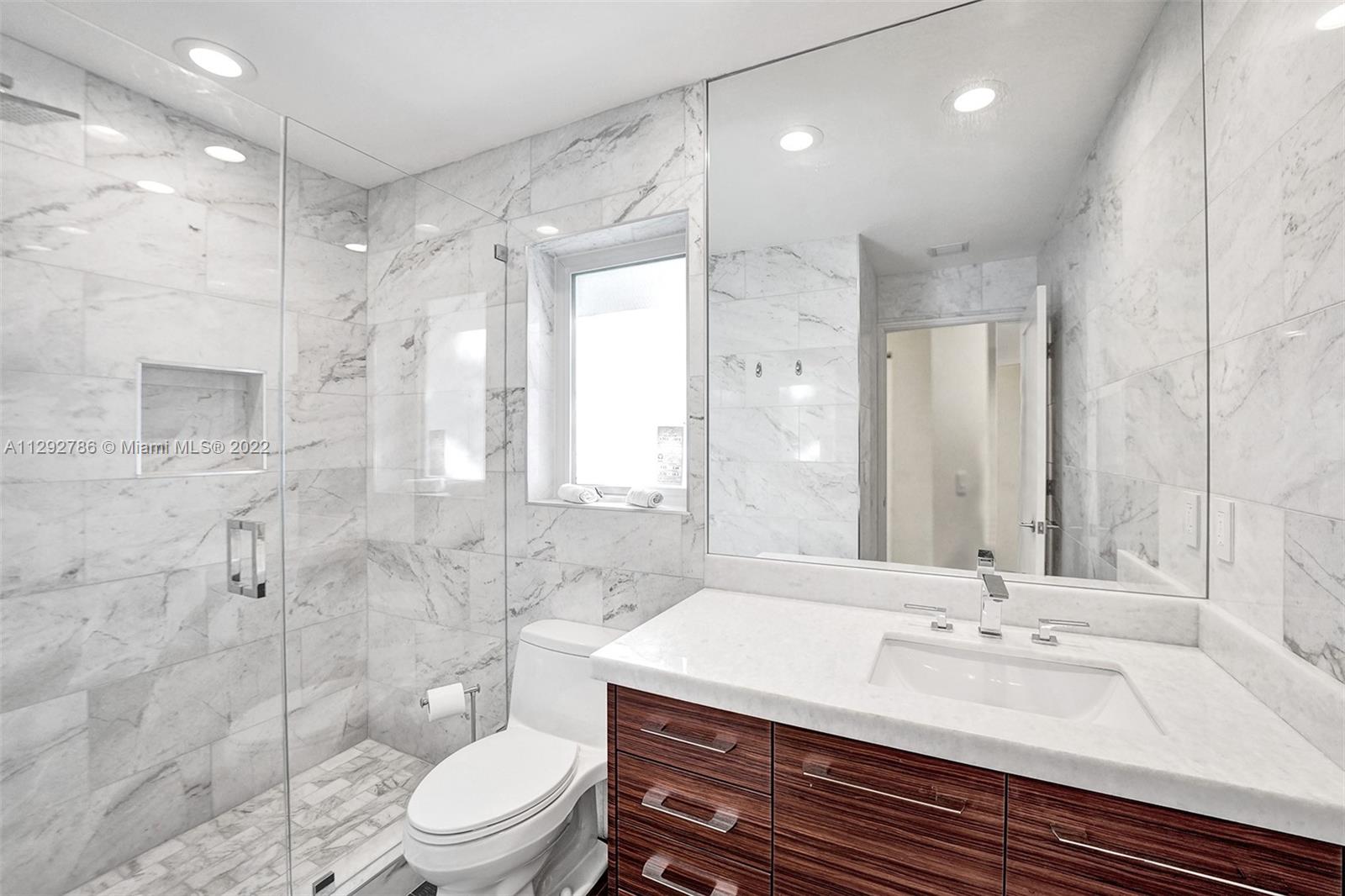 10150 Camelback Lane Boca Raton, FL 33498 - Photo 36 of 67 a bathroom with a sink a toilet and shower