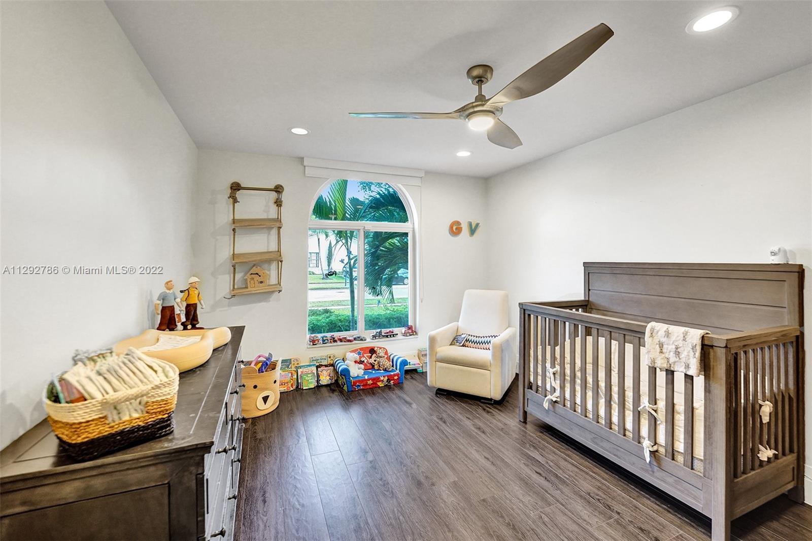 10150 Camelback Lane Boca Raton, FL 33498 - Photo 39 of 67 a bedroom with furniture and a large window