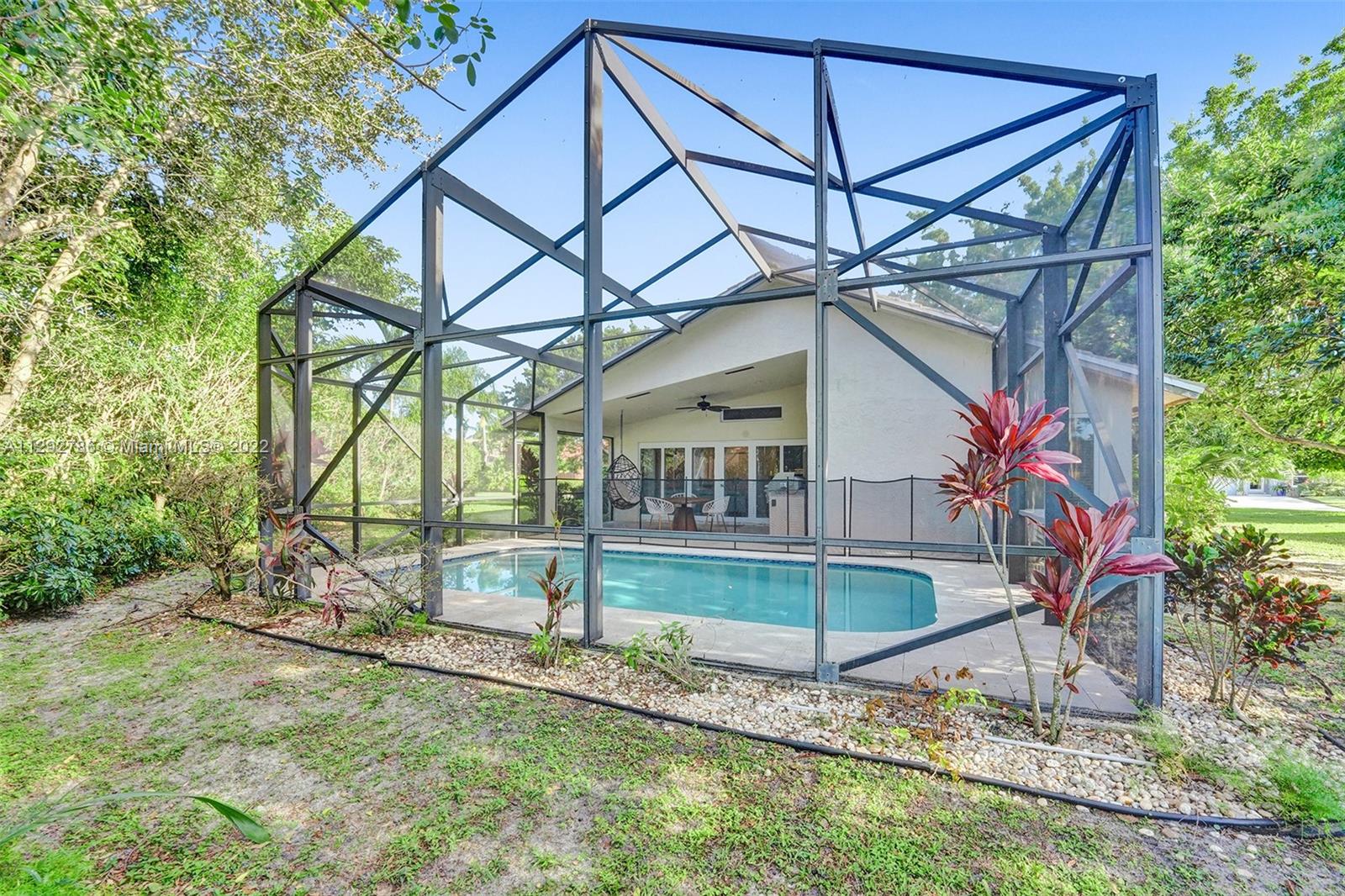 10150 Camelback Lane Boca Raton, FL 33498 - Photo 49 of 67 front view of house with a yard