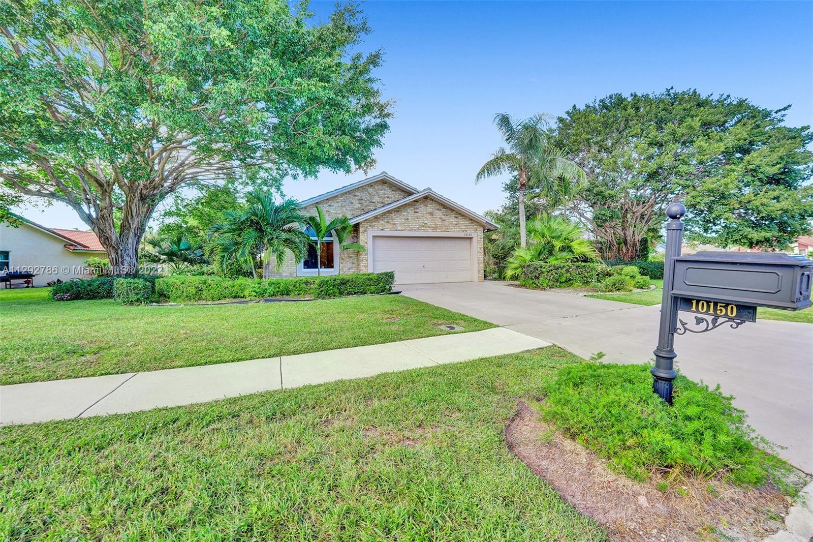 10150 Camelback Lane Boca Raton, FL 33498 - Photo 53 of 67 a view of a house with a yard