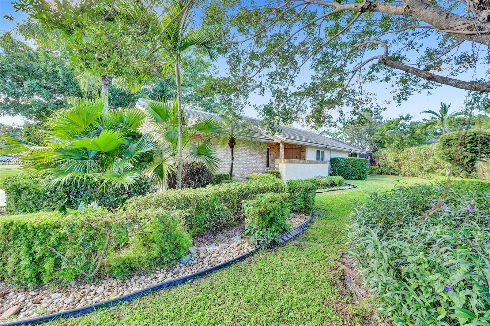 10150 Camelback Lane Boca Raton, FL 33498 - Photo 54 of 67 a house view with a garden space