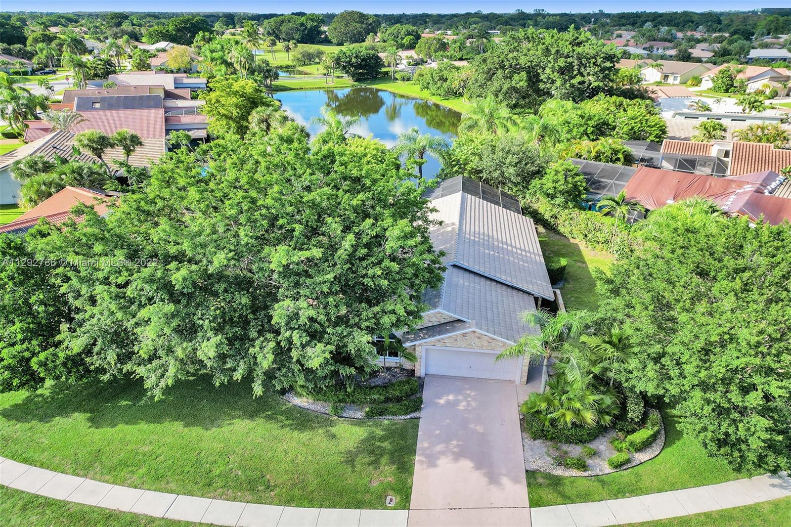 10150 Camelback Lane Boca Raton, FL 33498 - Photo 59 of 67 an aerial view of residential house with outdoor space and trees all around