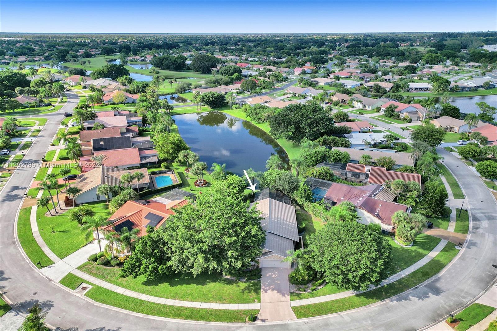 10150 Camelback Lane Boca Raton, FL 33498 - Photo 6 of 67 an aerial view of residential houses with outdoor space and street view