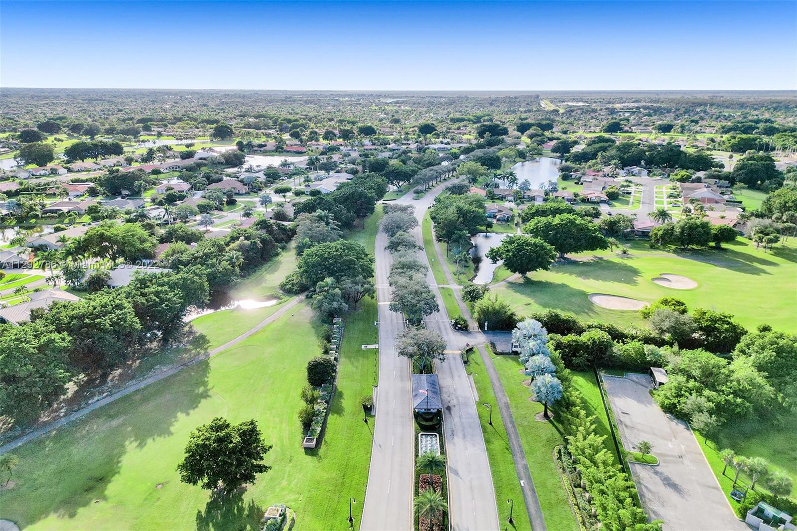 10150 Camelback Lane Boca Raton, FL 33498 - Photo 65 of 67 an aerial view of residential houses with outdoor space and swimming pool