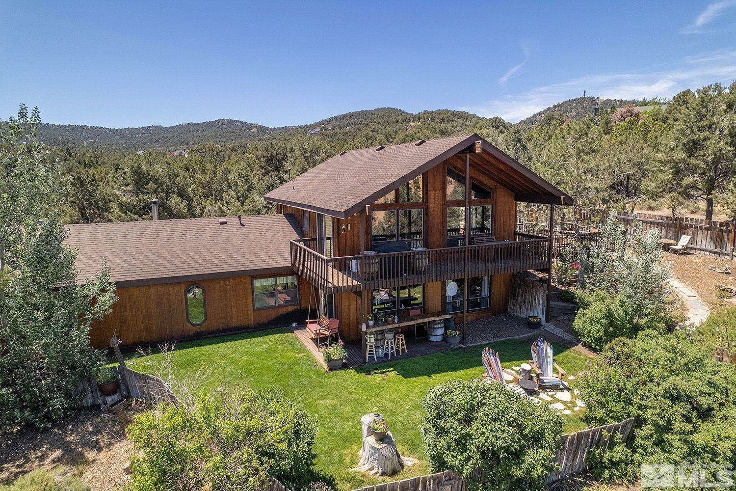 2090 Lousetown Road Reno, NV 89521 - Photo 1 of 30 a aerial view of a house with a big yard and large trees