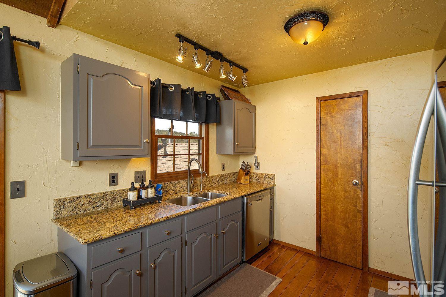 2090 Lousetown Road Reno, NV 89521 - Photo 12 of 30 a bathroom with a granite countertop sink mirror and double