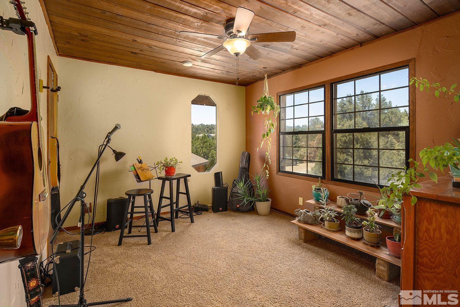 2090 Lousetown Road Reno, NV 89521 - Photo 19 of 30 a bedroom with furniture and a large window